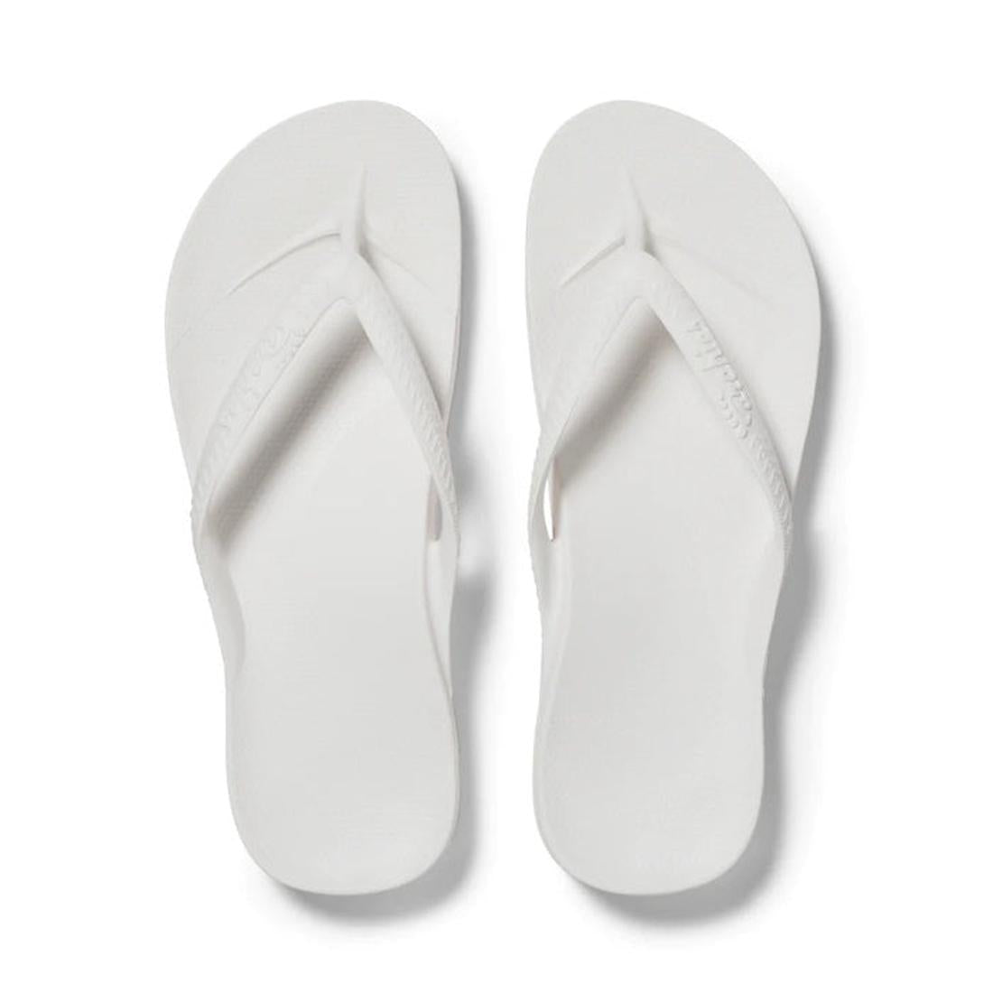 Archies Footwear's Archies Arch Support Jandal White—white sandals with comfy cushioned soles and secure textured straps, top view. ksnz