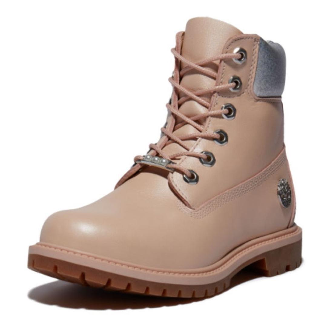 Timberland Heritage 6 Inch Waterproof Boot in light pink nubuck, with sturdy laces, cozy gray collar, and grippy brown sole. ksnz