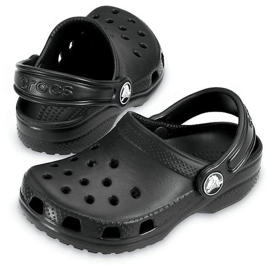 The Crocs Kids - Youths Classic Clog K Black Sandal features ventilation holes, adjustable heel straps, and a water-friendly design—ideal for comfort and everyday wear. Displayed on a white background.