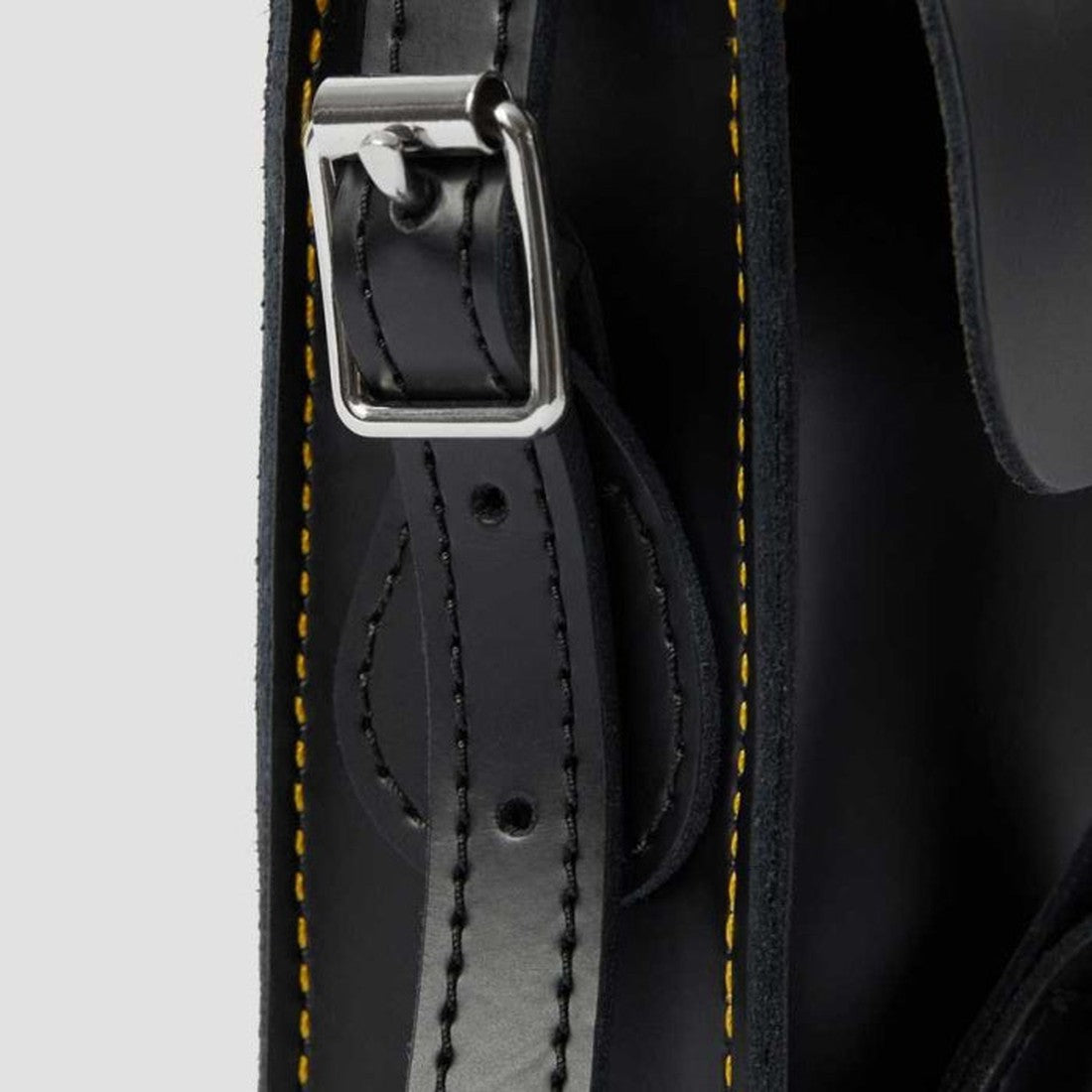 Dr Martens Leather Cross Body Satchel, 7" in classic black, sturdy sole, secure silver buckle closure, yellow-stitched strap shown.  ksnz, 190665191974