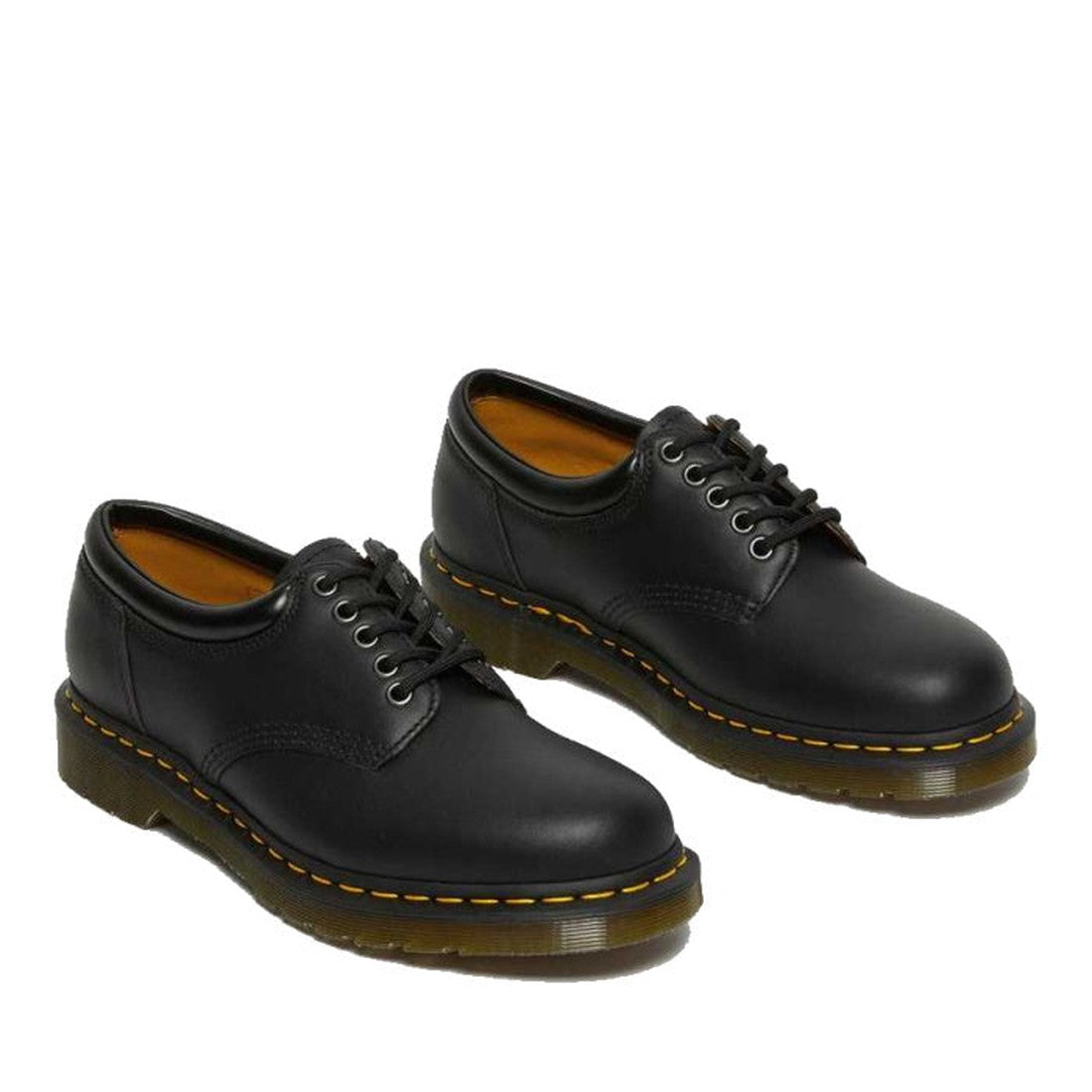 The Dr Martens 8053 Nappa Black Padded Collar Shoes are unisex lace-ups in black Nappa leather, featuring yellow stitching and thick translucent rubber soles, displayed on a white background., 800090824704, 800090824728, 800090801255, 800090801279, 800090