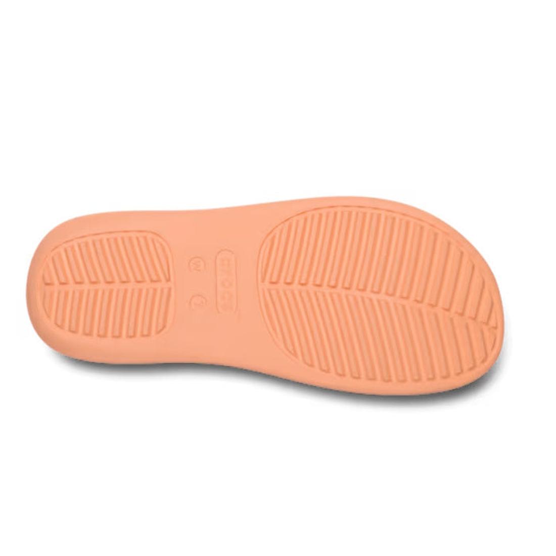 A sole view of the Crocs - Womens Getaway Strappy Slide Sandal in Electric Sunstone Orange shows peach-colored textured grooves and patterns for grip, from the Getaway Collection with Free Feel Technology., 48356, 198445274473, 198445274480, 198445274497,