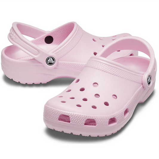 The Crocs - Classic Clog Ballerina Light Pink Adults features ventilation holes and adjustable heel straps in a unisex style, shown on a white background.