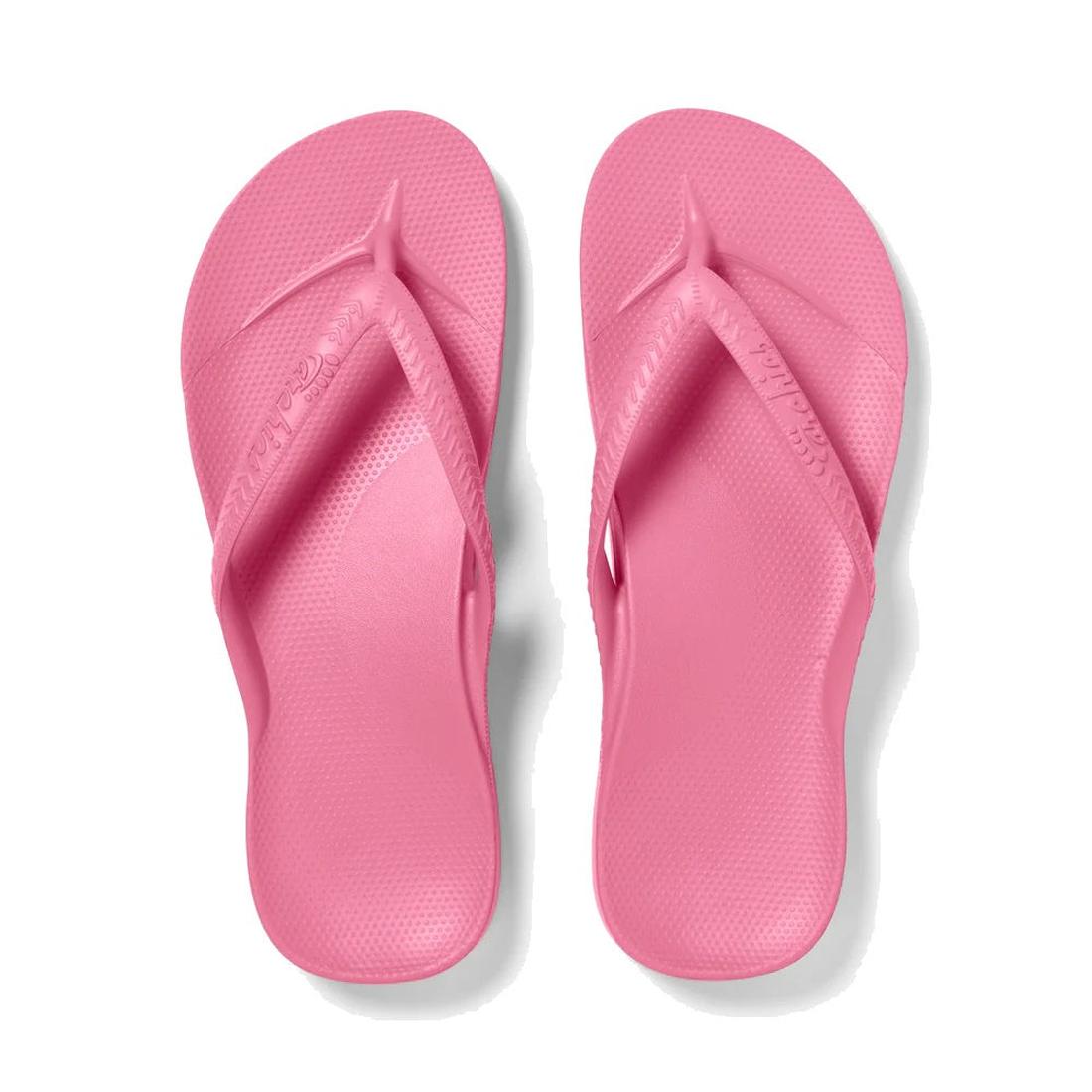 Archies Footwear Arch Support Jandal in bright pink, with comfy textured sole and secure wide straps, displayed overhead on white.  ksnz