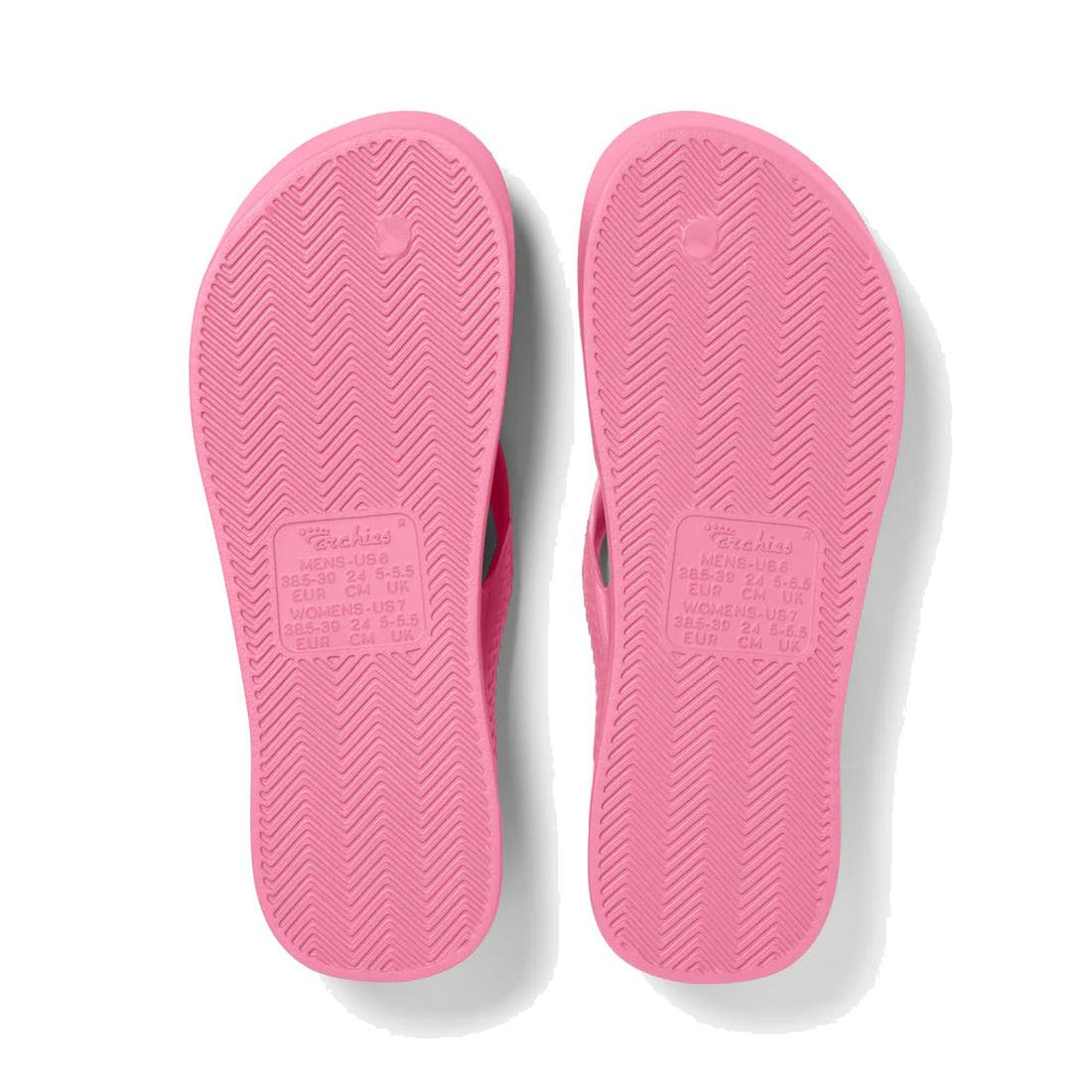 Archies Footwear Arch Support Jandal Hot Pink sandals, shown from beneath, display grippy textured soles and central embossed brand details.  ksnz, 9350311010924, 9350311010931, 9350311010948, 9350311010955, 9350311010962