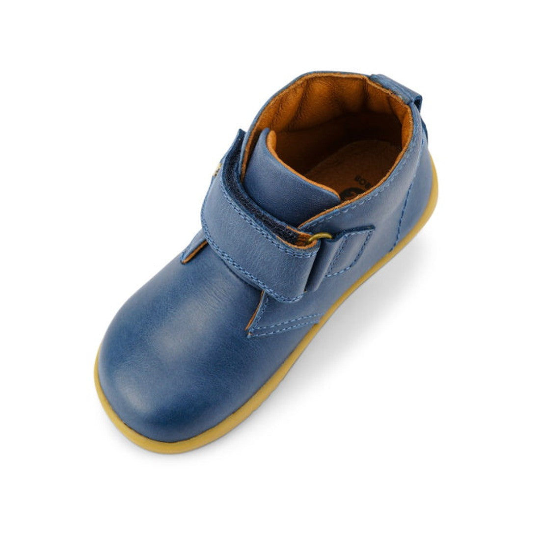 A single Bobux Iwalk IW Desert Boot Midnight Blue 625217, featuring a yellow sole, brown inner lining, and wide strap closure for easy fastening, is viewed from above on a white background., 9420068516984, 9420068516991, 9420068517004, 9420068517011, 9420