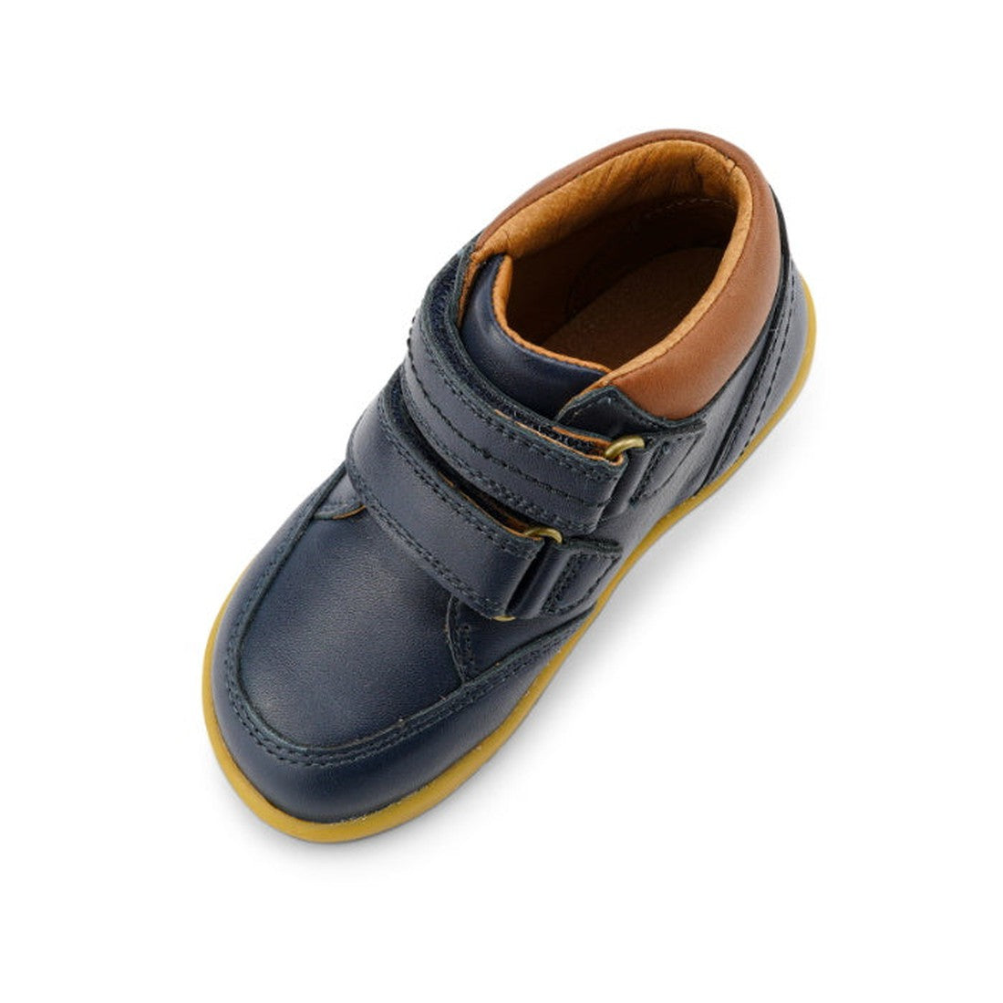 The Bobux Iwalk Timber Navy Leather Boot 632619 is a single unisex kids' boot in dark blue leather with a tan lining, yellow sole, and two adjustable straps, shown from above on a white background., 9420068529298, 9420068529304, 9420068529311, 94200685293