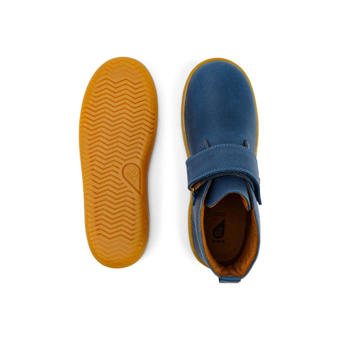 The Bobux Kid+ Desert Boot Midnight Blue 830312 is a pair of children's blue high tops with brown soles. One shoe showcases the wide velcro opening from above, while the other displays the textured herringbone-patterned sole., 9420068517035, 9420068517042