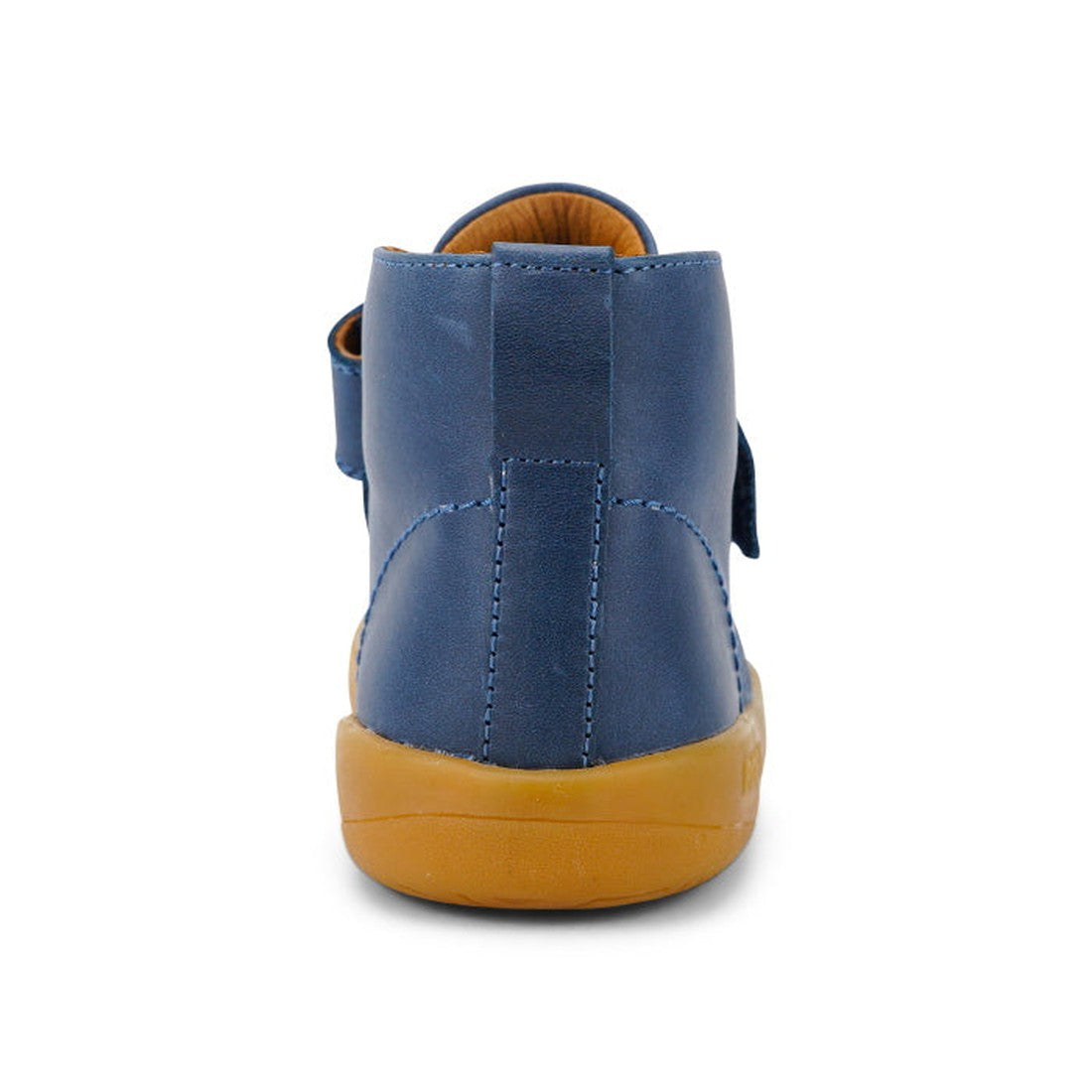 The Bobux Kid+ Desert Boot Midnight Blue 830312 is a blue high-top shoe with a tan rubber sole, seen from the back. It features a wide Velcro opening, vertical heel seam, and visible stitching details., 9420068517035, 9420068517042, 9420068517059, 9420068
