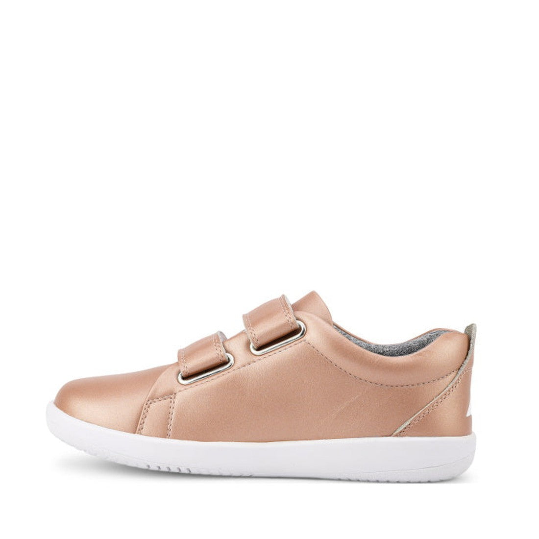 The Bobux Kids + Plus Grass Court Rose Gold Velcro Trainers 832455 feature a leather upper, double velcro straps, white rubber sole, and slightly padded collar, shown in side view with a sleek rose gold design., 9420071315741, 9420071315758, 9420071315765