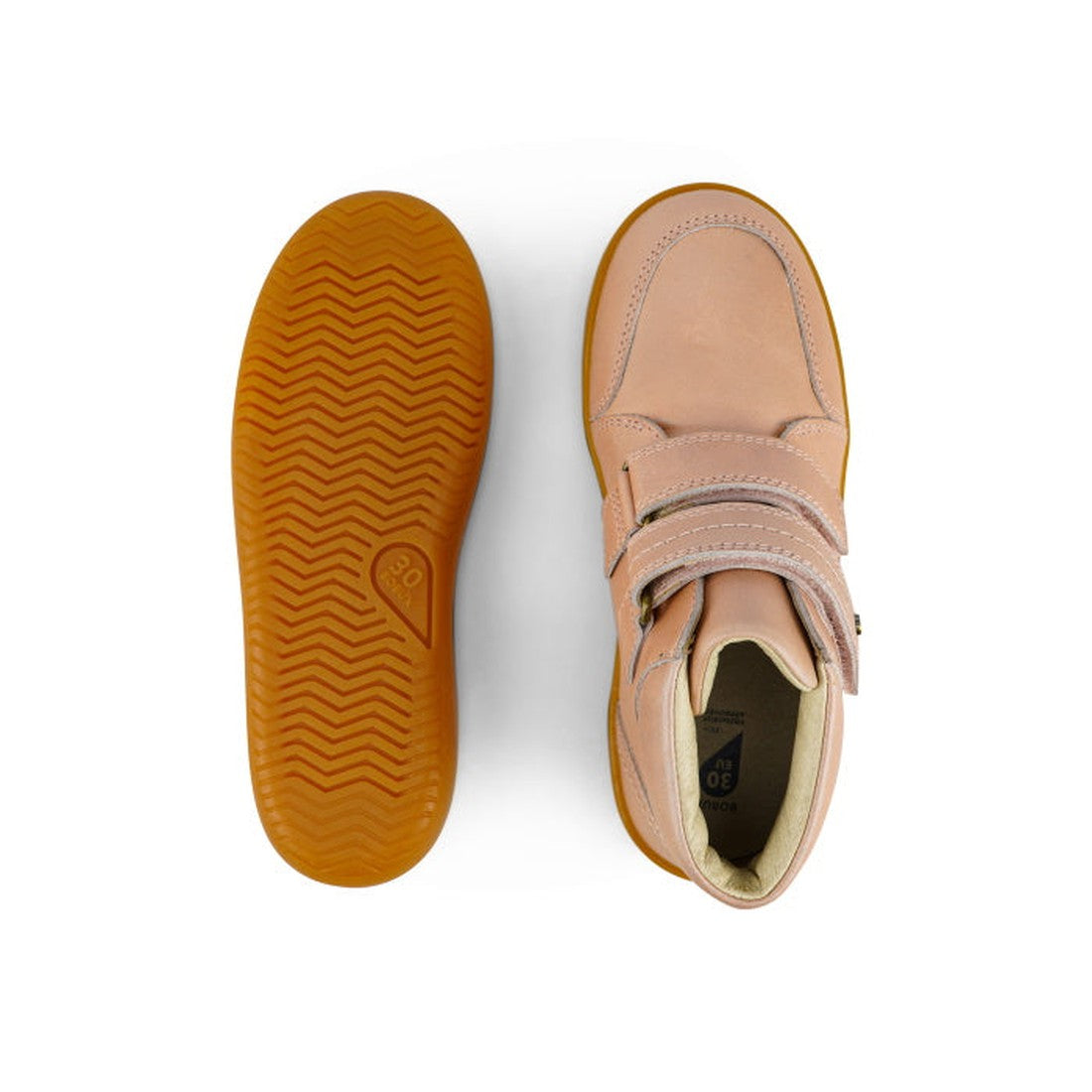 The Bobux Kids Plus KP Timber Boot Dusk Pearl Pink 832918 features smooth pink leather, tan rubber soles with a wavy tread, and double hook-and-loop straps. One shoe is shown from the bottom; the other displays the top view., 9420068534308, 9420068534315,
