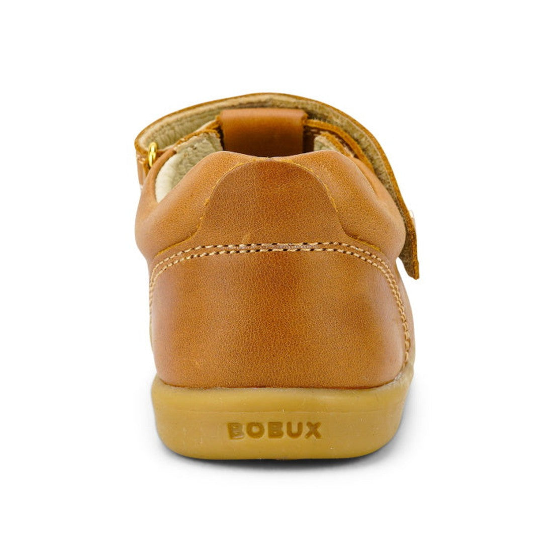 A close-up rear view of the Bobux Iwalk IW Louise T-Bar Caramel Tan children's shoe with visible stitching, an adjustable strap, and "BOBUX" embossed on the rubber sole., 9420062092170, 9420062092187, 9420062092194, 9420062092200, 9420062092217