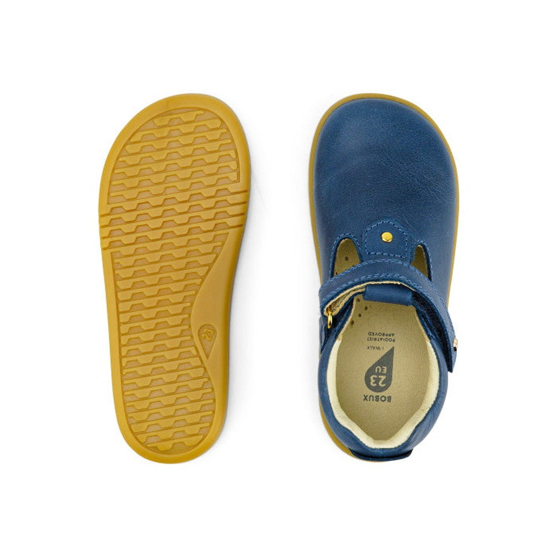 The Bobux IW Iwalk Louise Midnight Blue 633030 children’s T Bar shoes are shown from above and below, displaying a blue leather upper, yellow-brown rubber sole with wavy tread, and a velcro strap across the top., 9420068521841, 9420068521858, 942006852186