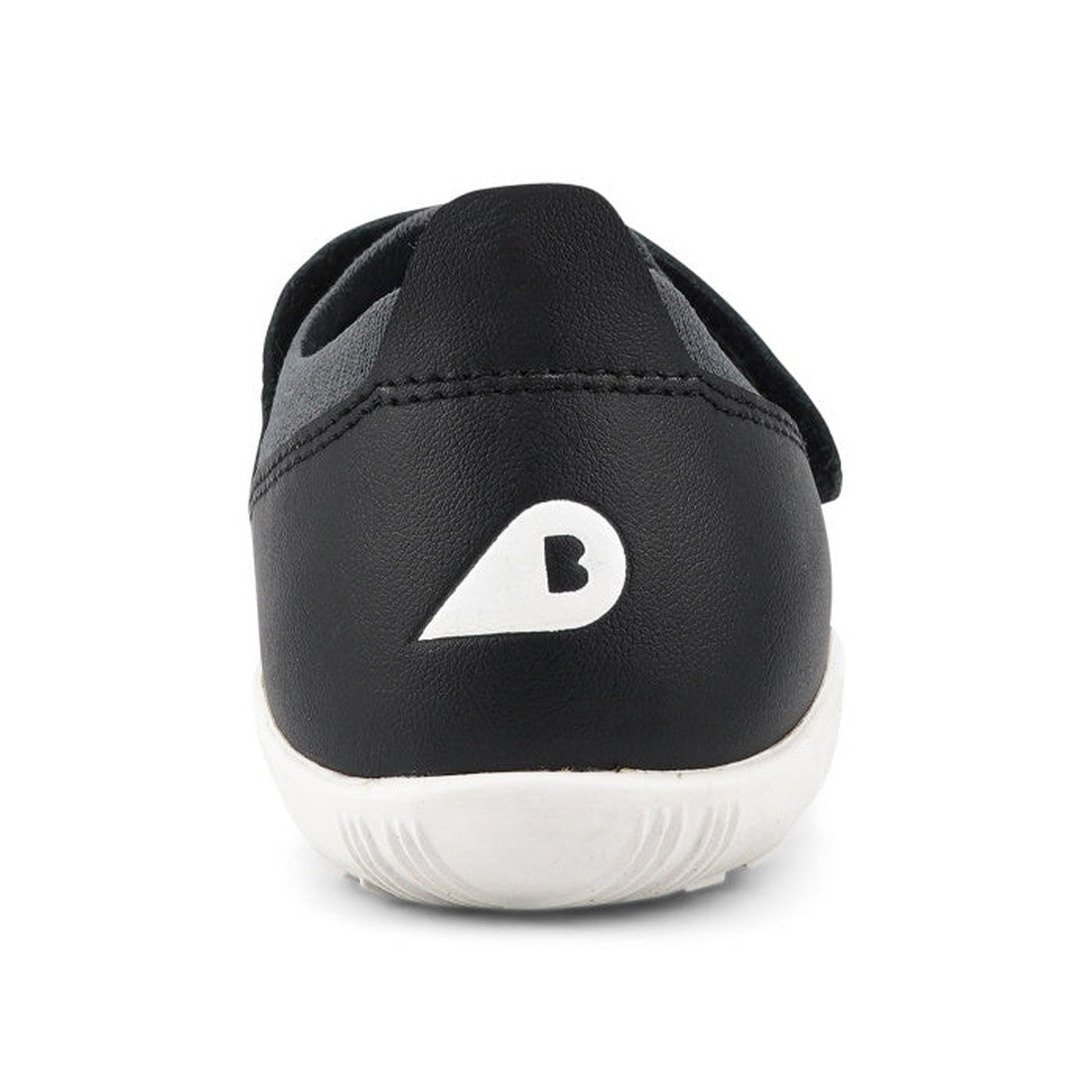 A close-up rear view of the Bobux Kid+ Lo Dimension III Black 838604 CLEARANCE, a merino performance shoe with a lightweight flexible sole and white B logo on the heel. The background is plain white., 9420068517202, 9420068517219, 9420068517226, 942006851
