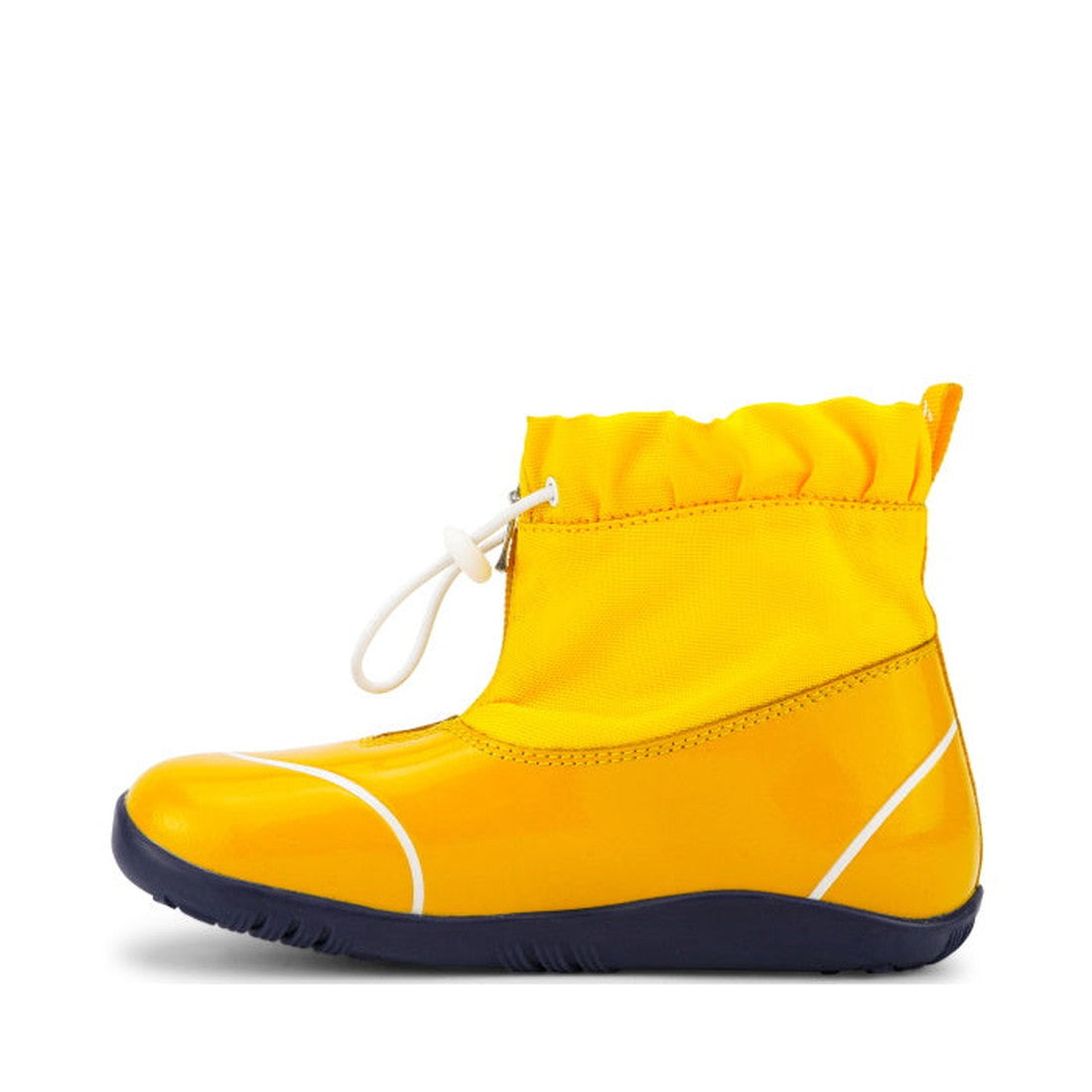 The Bobux Kid+ Splash Boot Waterproof Yellow 839001 is a bright yellow lightweight kids’ shoe with a glossy finish, dark blue sole, and white adjustable drawstring at the ankle, shown from the side against a white background., 9420068528420, 9420068528437