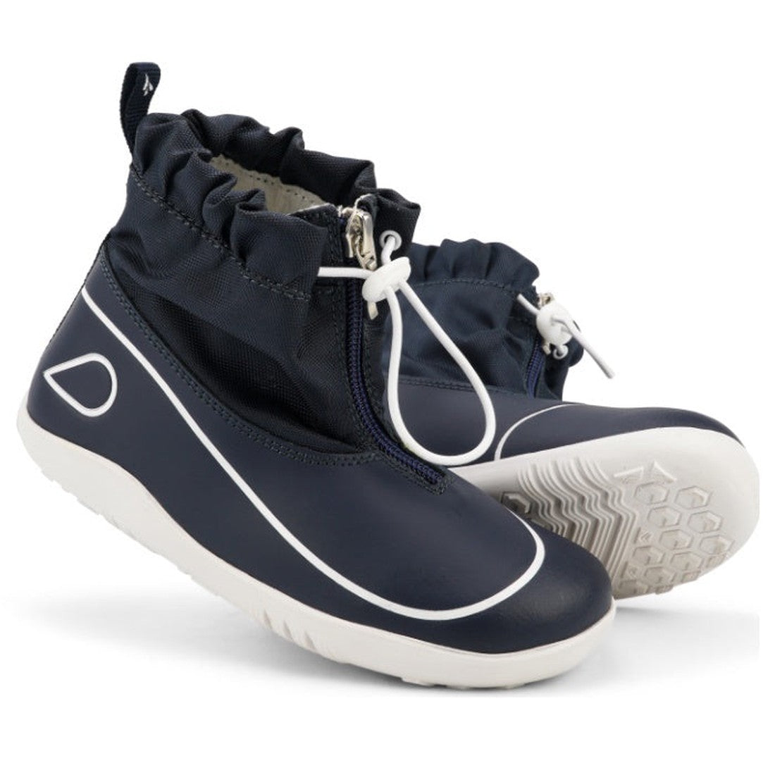 The Bobux Kid+ Splash Boot Waterproof Navy 839004 is a pair of kids' navy slip-on boots with white soles, white trim, elastic drawstring ankle closures, and textured tread for extra grip.