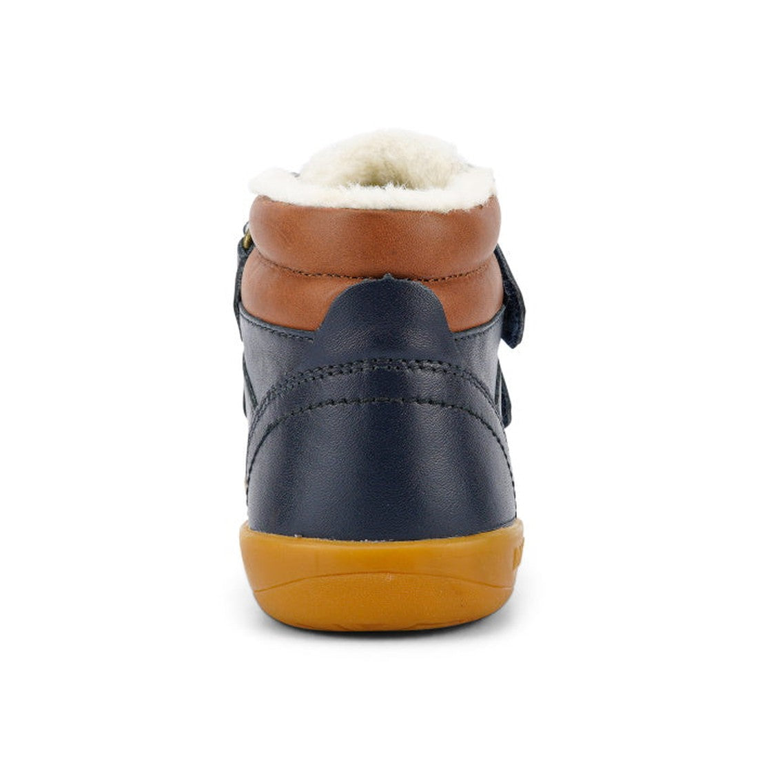 The Bobux Kid+ Timber Arctic WATERPROOF Boot Navy 836003E is shown from the back, featuring navy blue leather, a brown collar, white fuzzy lining, and a tan rubber sole against a white background., 9420068529489, 9420068529496, 9420068529502, 942006852951