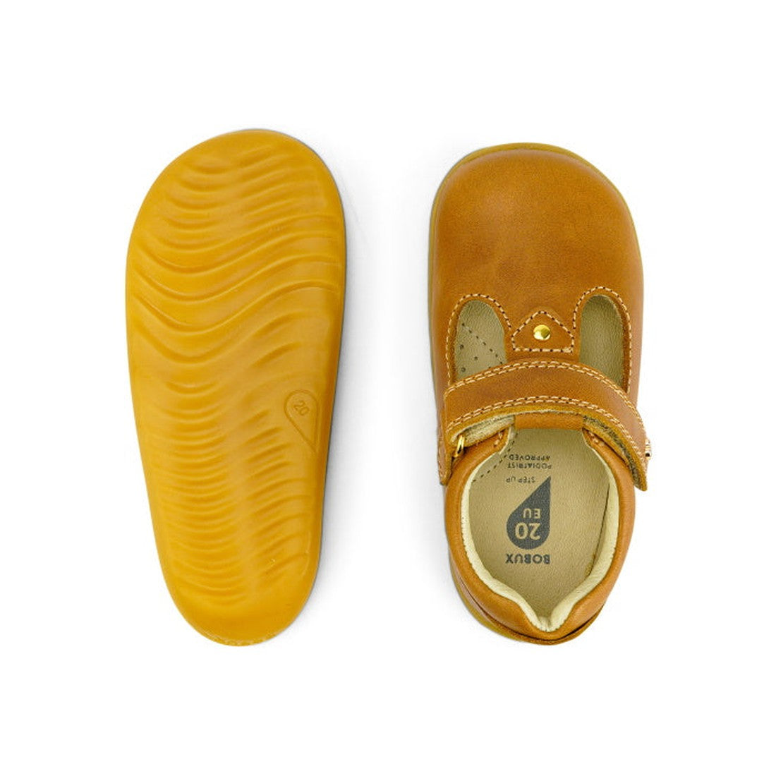 The Bobux Step Up T-Bar Louise Tan Caramel 728318 toddler shoes feature a tan leather upper with a Velcro strap; one shoe is shown from the top, while the other displays its flexible, textured yellow sole., 9420062092132, 9420062092149, 9420062092156, 942