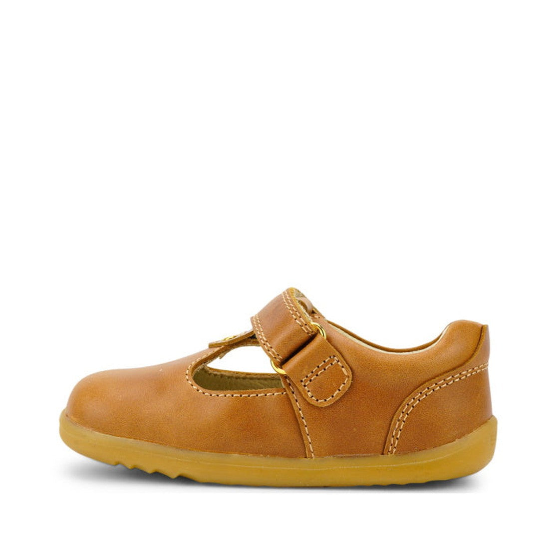 The Bobux Step Up T-Bar Louise Tan Caramel 728318 is a single children’s T-bar shoe in brown leather with a velcro strap, soft yellow rubber sole, and white stitching, shown in profile on a white background., 9420062092132, 9420062092149, 9420062092156, 9