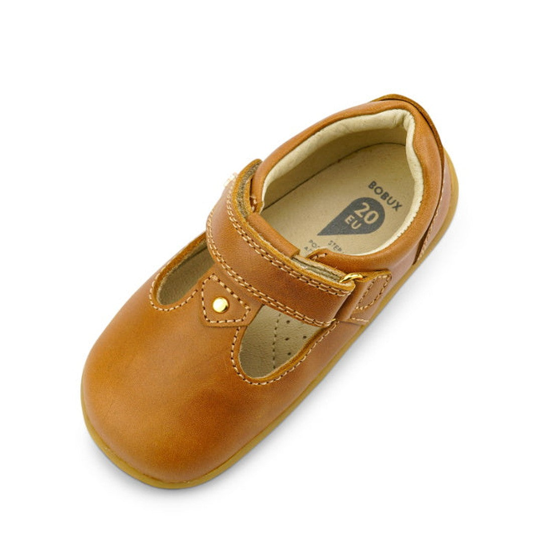 The Bobux Step Up T-Bar Louise Tan Caramel 728318 is a single brown children’s leather shoe (EU size 20) with a rounded toe, soft beige interior, leather upper, and a strap fastened by a metal snap., 9420062092132, 9420062092149, 9420062092156, 9420062092
