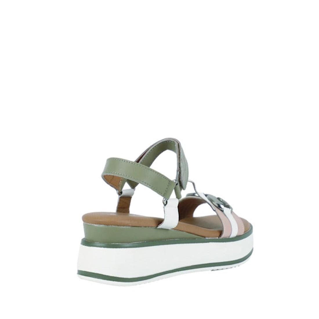 The Bay Lane Liberty Green Multi Women's Leather Wedge Sandal features a thick white platform sole, cushioned footbed, green adjustable ankle strap, and interwoven green, white, and light pink straps, shown from a rear side angle on a plain white backgrou