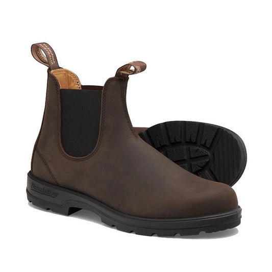 Blundstone 2340 Chelsea Pull On Boots in rich brown feature slip-on design crafted from premium water-resistant leather, with black elastic side panels, pull tabs, and a treaded XRD® Technology sole. One boot stands upright while the other lies on its sid