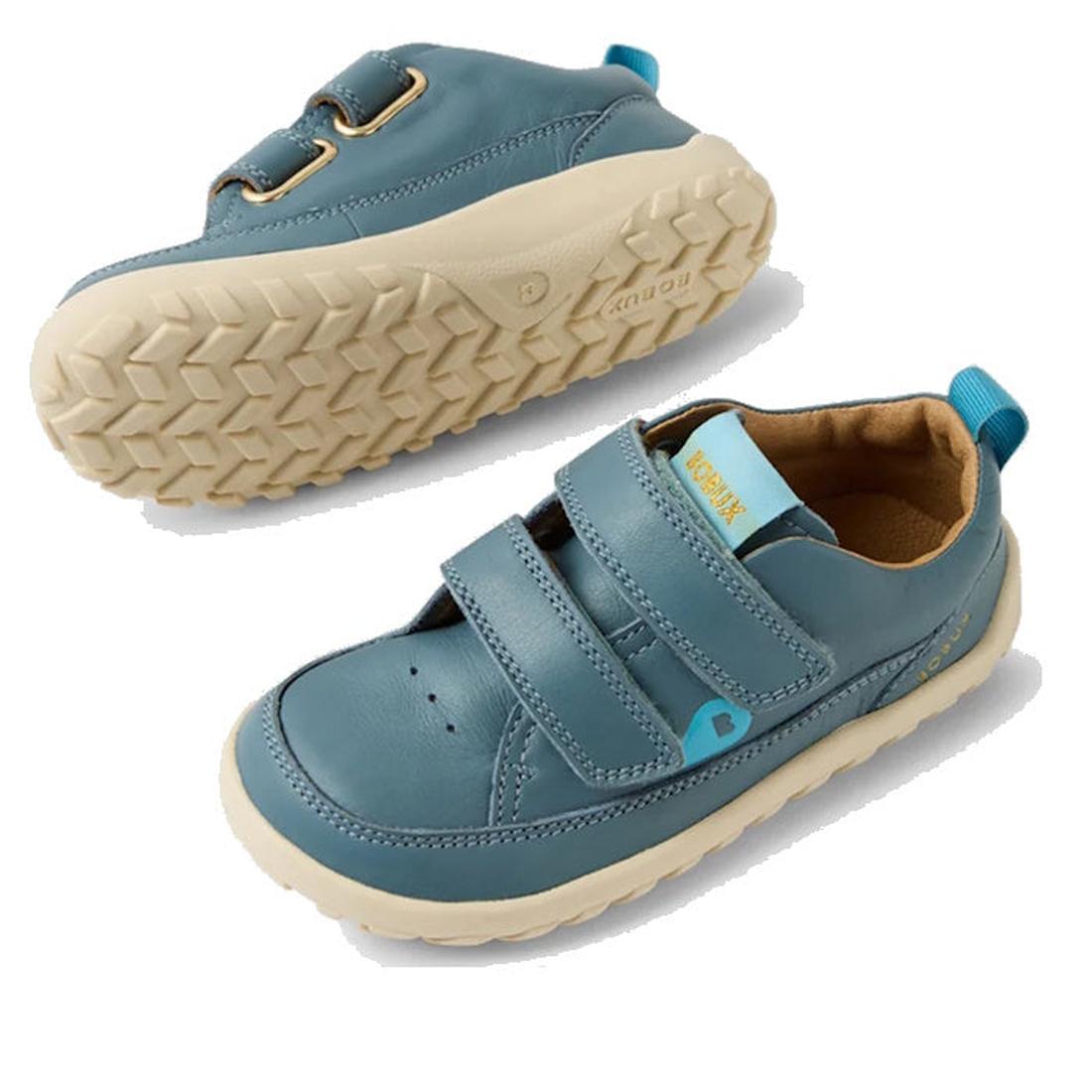 The Bobux IW Iwalk Dawn Toddlers Sneaker in Stormy Weather Blue has a soft beige sole, easy Velcro straps, and child-friendly fit.  ksnz