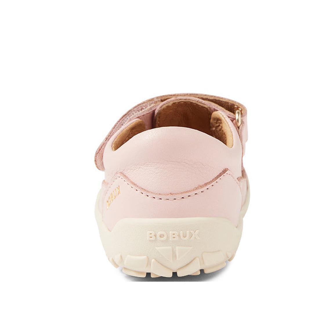 A rear view of a pink Bobux IW Iwalk Troop Toddlers Leather Sandal in Cameo Rose features a white zero drop sole, BOBUX embossed on the heel, a visible Velcro strap on top, and tan interior lining., 46383, 9420068562561, 9420068562578, 9420068562585, 9420
