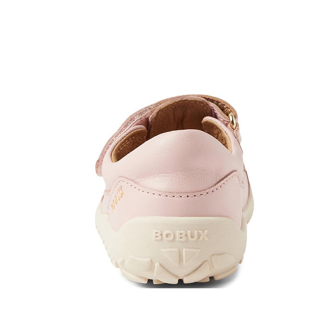 A close-up rear view of the Bobux Kid+ Troop Leather Closed Toe Sandal in Cameo Rose Pink with a cream sole. BOBUX is embossed on the heel, and its wide toe box offers comfort. Set against a plain white background., 9420068562882, 9420068562899, 942006856