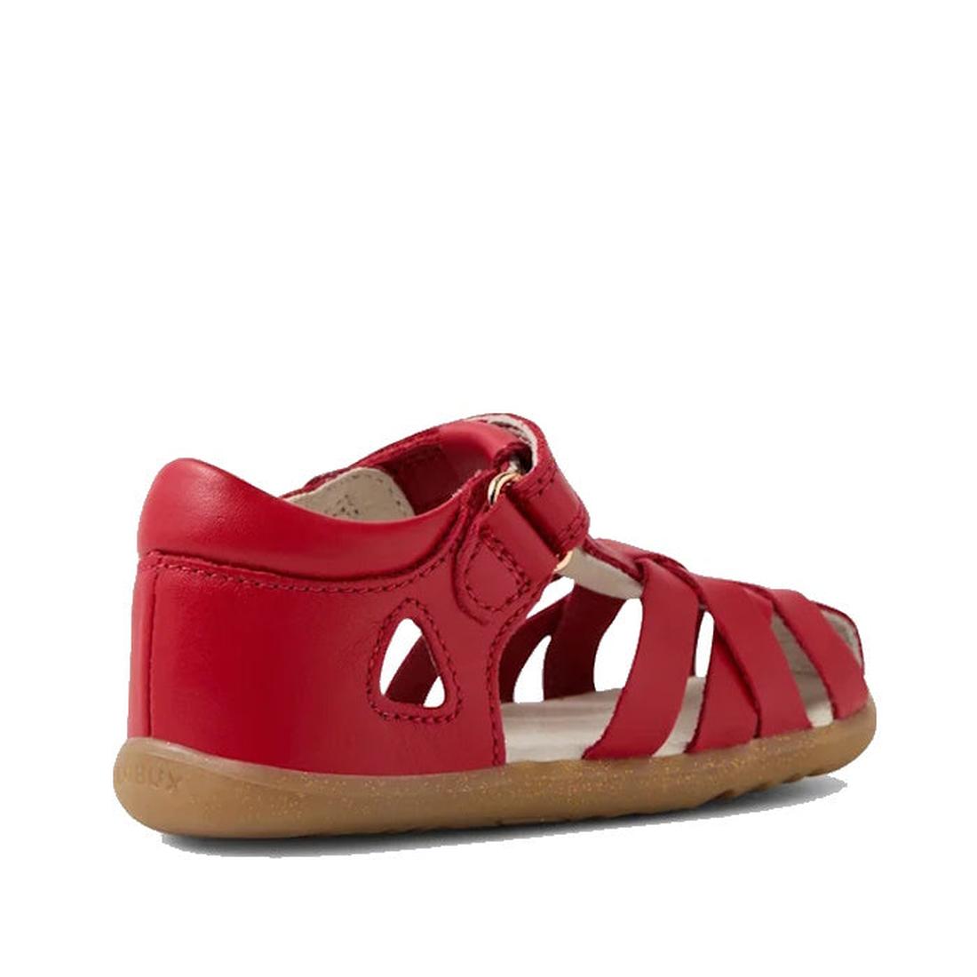 The Bobux Step Up Tropicana II Salsa Red Leather Sandal First Walker is a kids' strappy sandal with a closed heel, cutouts, multiple front straps, tan rubber sole, and hook-and-loop fastener. Made of quick-dry leather. Shown on a white background., 49363,