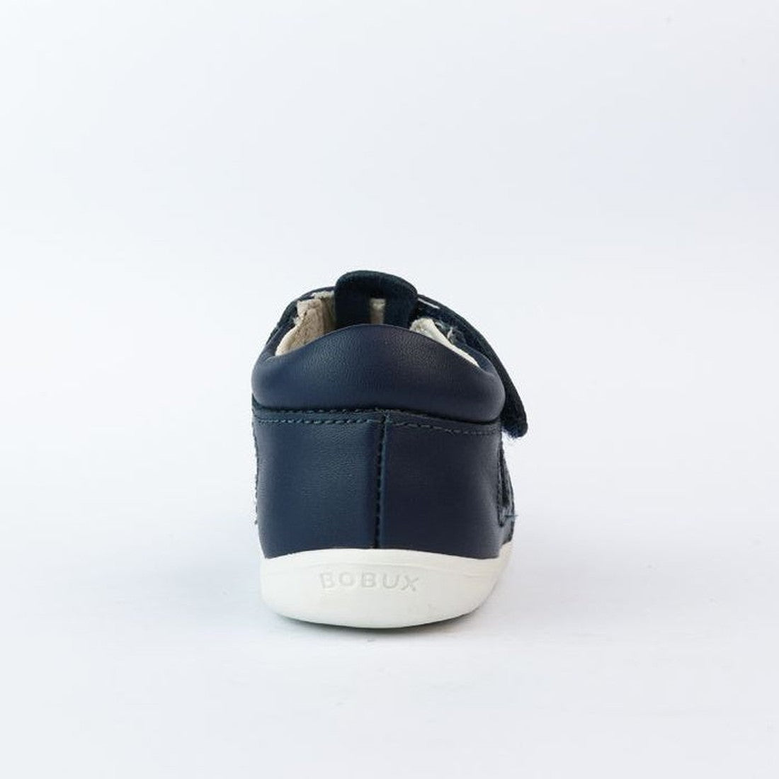 The Bobux Step Up Zap II Navy Closed Toe Sandal 732404 Quick Dry for children is shown from the back, featuring quick-drying leather, a white sole, and BOBUX embossed on the heel against a plain white background., 9420068505476, 9420068505483, 94200685054