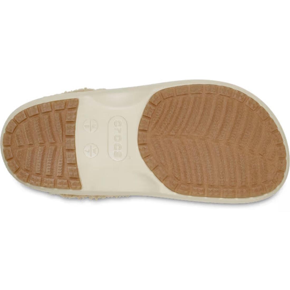 The image shows the bottom view of a Crocs Adults Classic Lined Shorty Clog in Sandstone Off White, featuring a beige design with a textured tan rubber sole and "Crocs" stamped at the center., 198445245961, 198445245978, 198445245985, 198445245992, 198445