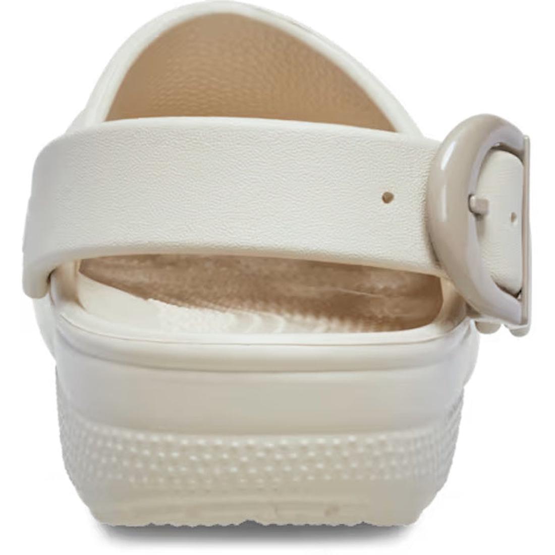 A close-up rear view of the Crocs Adults Classic Enamel Buckle Clog Frappe, showing its thick Croslite foam sole, textured footbed, and a wide back strap with a round buckle on the right for signature Crocs Comfort., 198445415944, 198445415951, 1984454159, 198445415968, 198445415975, 198445415982, 198445415999