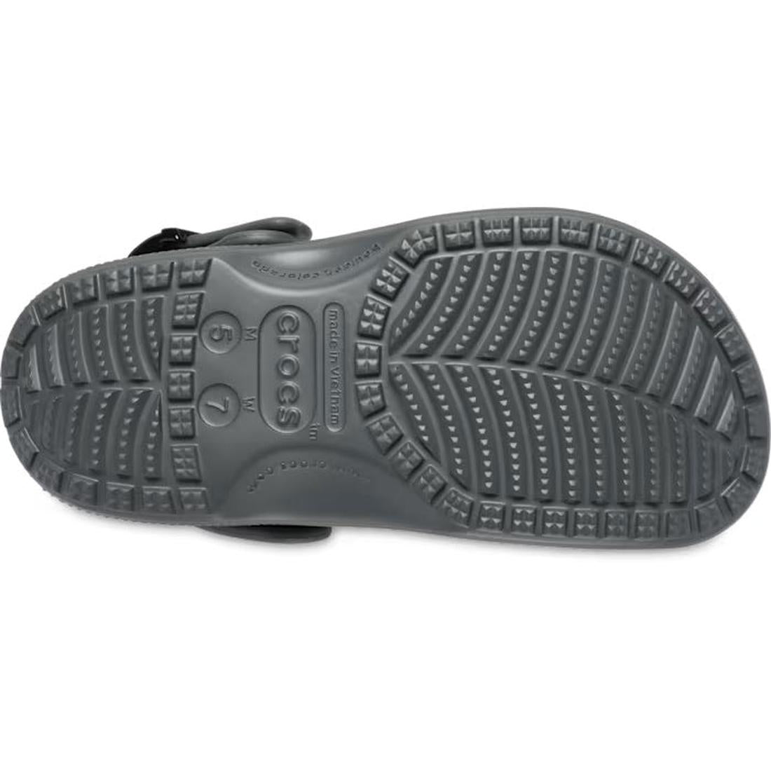 The underside of the Crocs Adults Classic Enamel Buckle Clog Carbon Grey reveals detailed tread, size markings 6 7, and the Crocs logo molded into its Croslite foam sole., 51696, 198445415715, 198445415722, 198445415739, 51700, 51701, 51696, 198445415715,, 198445415746