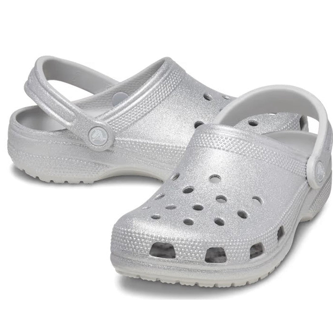 The Crocs - Classic Clog Adults Silver Glitter features ventilation holes, textured soles, and adjustable heel straps—stylish, comfortable, and ideal for any occasion. Displayed on a white background.