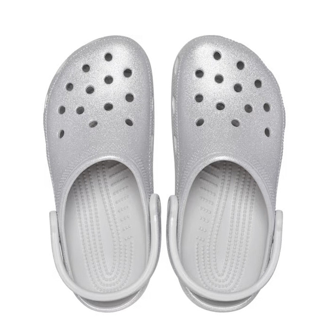 A pair of Crocs - Classic Clog Adults Silver Glitter with top ventilation holes and adjustable heel straps for comfort, shown from above on a white background., 196265542390, 196265542406, 196265542413, 196265542420, 196265542437, 196265542444, 1962655424