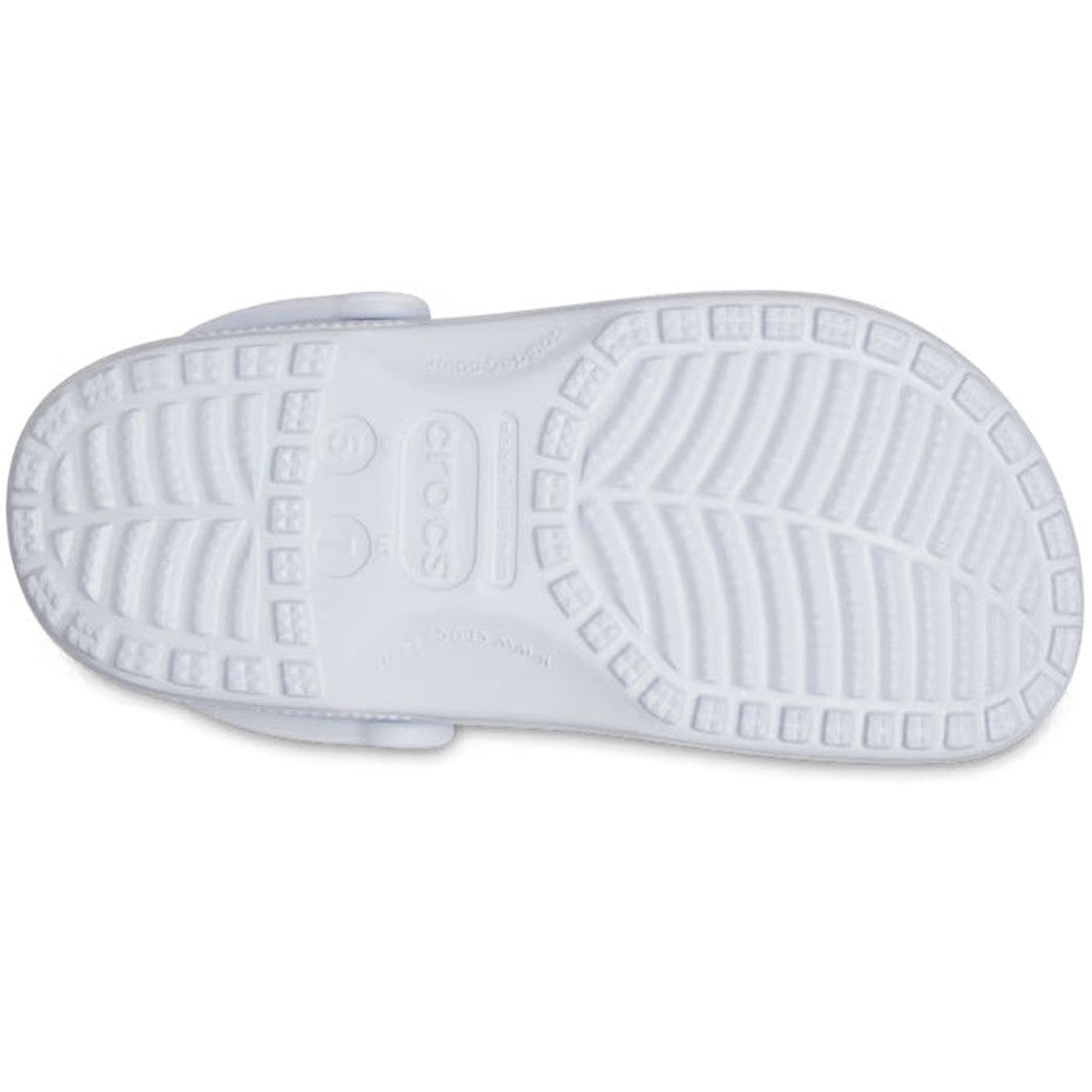 The image shows the sole of a Crocs - Classic Clog Adults Dreamscape Purple, featuring a textured tread pattern with grooves and square-shaped grips. Embossed in the center are the Crocs logo, size markings, and unisex Crocs Comfort branding., 19626553180, 196265531806, 196265531813, 196265531820, 196265531837, 196265531844, 196265531851, 196265531745, 196265531752, 196265531769