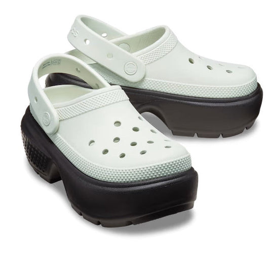 A pair of Crocs Stomp Classic Clog Adults in Black Linen 2 Tone, featuring chunky platform soles and perforated uppers, shown against a white background.