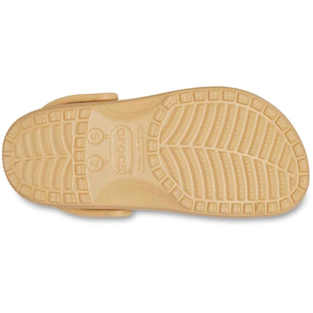 The Crocs - Classic Clog Wheat Tan Adults is shown from the bottom, displaying its textured wavy sole and size markings near the heel—showcasing lightweight comfort and the iconic unisex design., 196265698592, 196265698608, 196265698615, 196265698622, 196