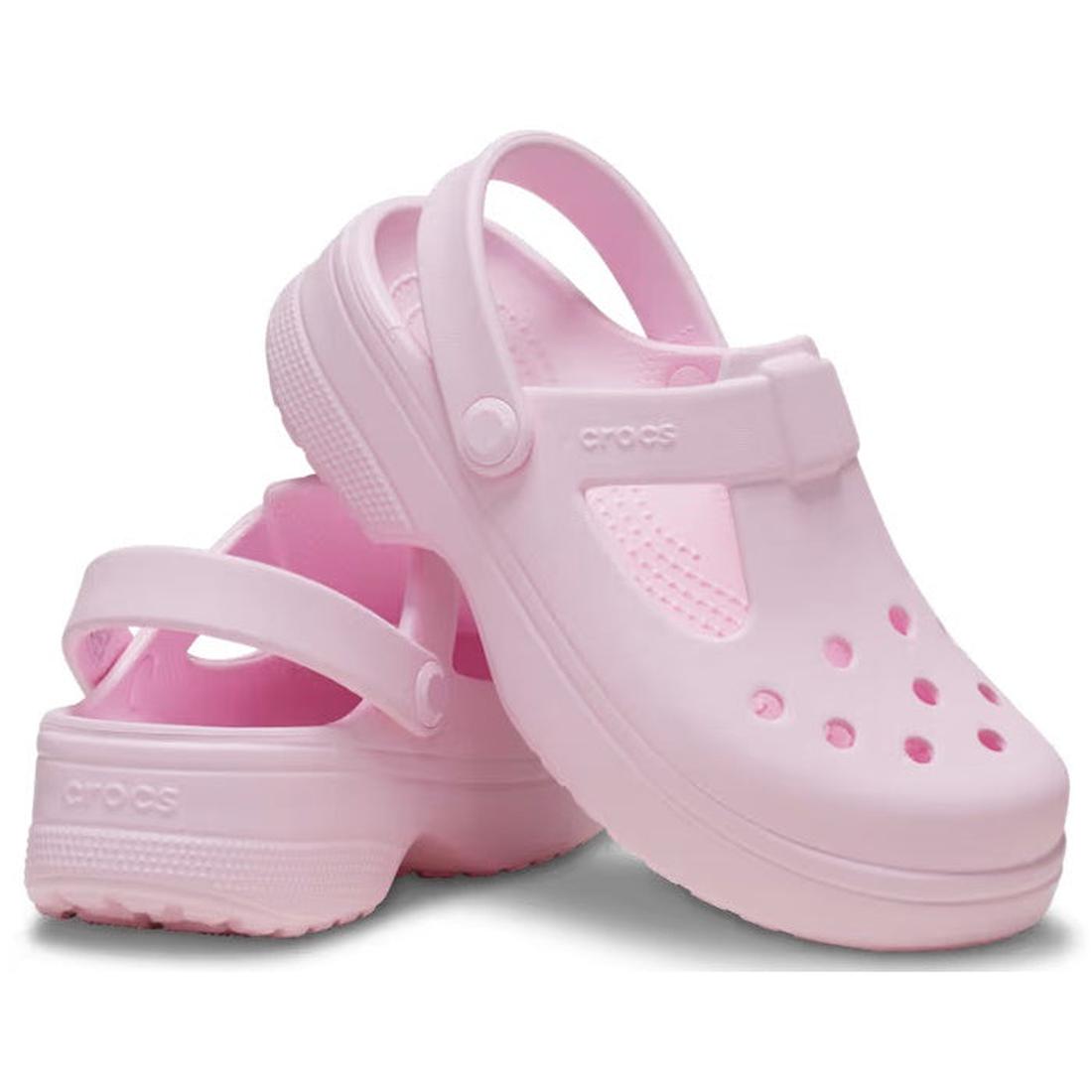 A pair of Crocs Kids Classic Mary Jane Clog K in Pink Milk, featuring heel straps and ventilation holes, stacked with one shoe leaning on the other.