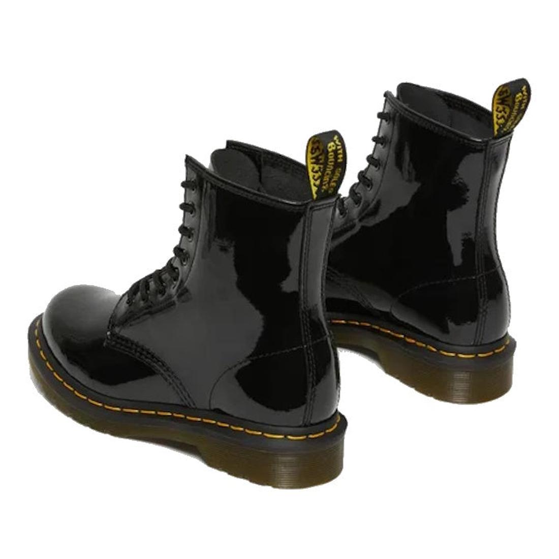 Black patent Dr Martens  leather boots with yellow stitching view from heel looking forward on a white background.,
883985035249,
883985035256,
883985035270,, 45130, 45131, 883985035249, 883985035256, 883985035270, 45138, 45139