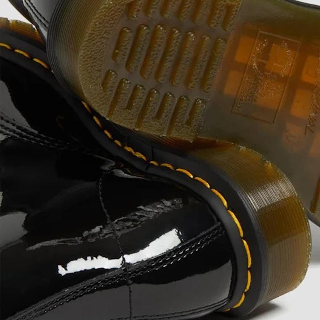 Close-up of black glossy Dr Martens 1460 Patent boots with yellow stitching and sole.
883985035249,
883985035256,
883985035270,, 45130, 45131, 883985035249, 883985035256, 883985035270, 45138, 45139