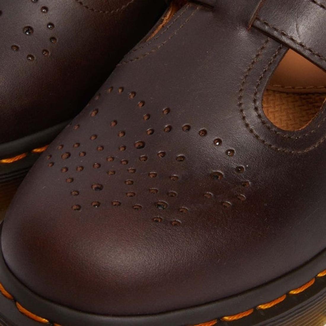Close-up of the Dr Martens 8065 2 Strap Mary Jane Shoe in Crazy Horse Brown, showing dual buckles, decorative toe perforations, and signature yellow stitching on the black rubber sole., 190665588941, 190665588958, 190665588965, 190665588972, 13164654654, 