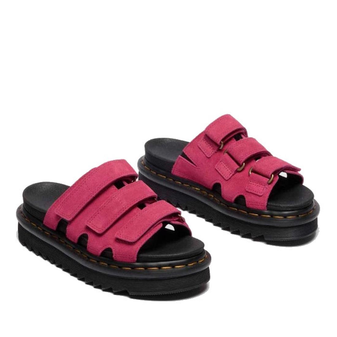 The Dr Martens Raine Fuchsia Pink Greasy Suede Leather Slides feature chunky black EVA Zebrilus soles and bright pink suede straps with three adjustable Velcro closures, shown on a white background., 47985, 190665750270, 190665750287, 190665750300, 47989