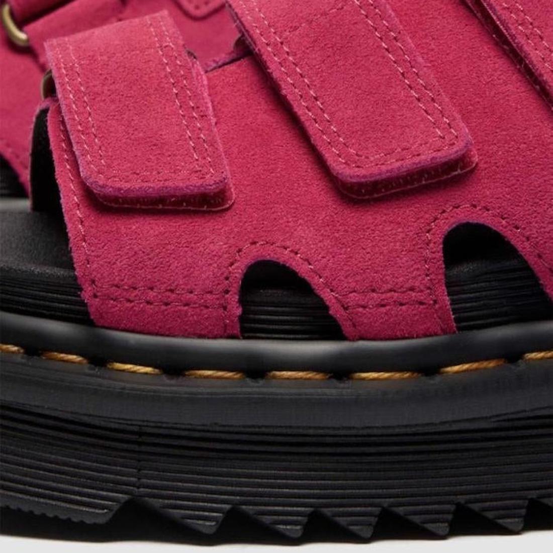 Close-up of Dr Martens Raine Fuchsia Pink Greasy Suede Leather Slides, featuring Velcro straps, black EVA Zebrilus sole with visible stitching, and a textured tread pattern., 47985, 190665750270, 190665750287, 190665750300, 47989