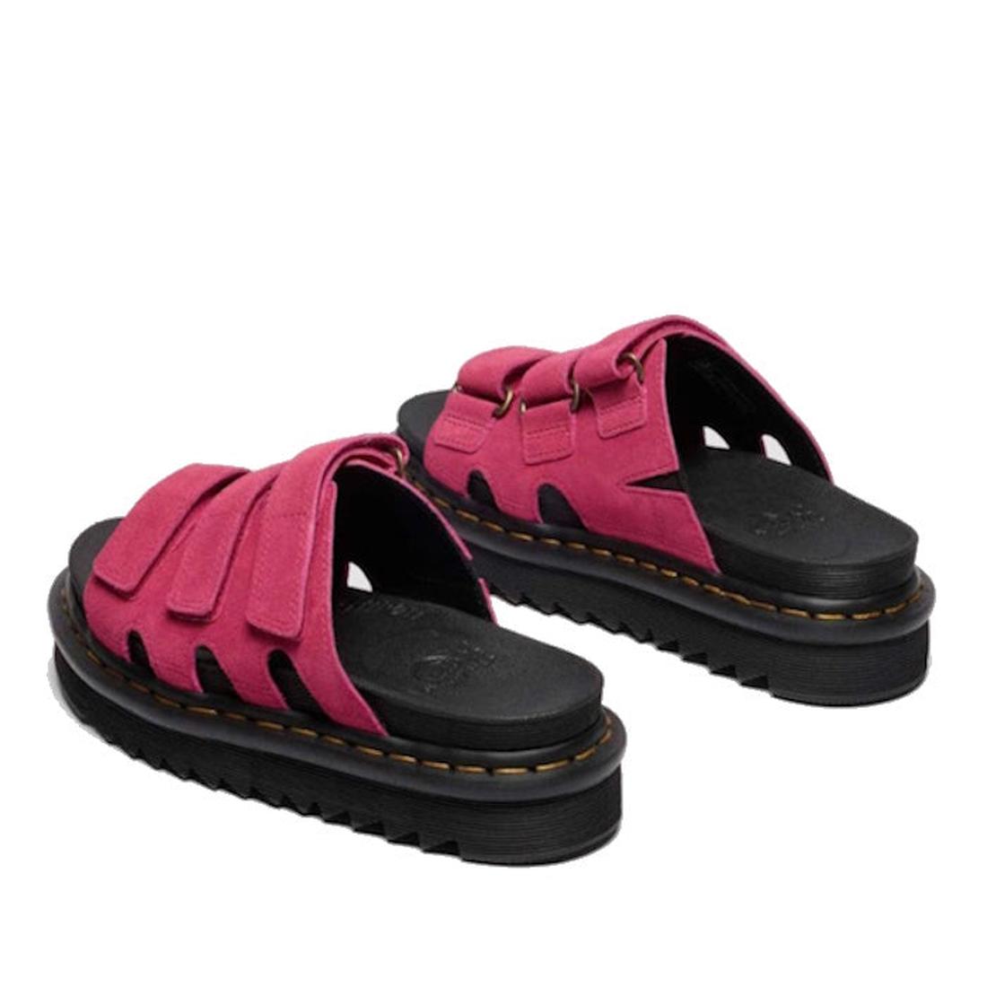 The Dr Martens Raine Fuchsia Pink Greasy Suede Leather Slides feature chunky black EVA Zebrilus soles and wide, bright pink suede straps with exposed stitching and a rugged, layered sole design for a bold look., 47985, 190665750270, 190665750287, 19066575