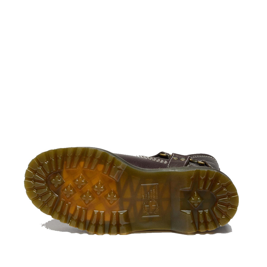 The Dr Martens Anistone Hi Flower Bex Grizzly Dark Brown boot is shown from below, showcasing its thick, translucent rubber sole with deep treads, geometric shapes, and textured details for enhanced grip and traction., 52349, 190665773651, 190665773668, 1