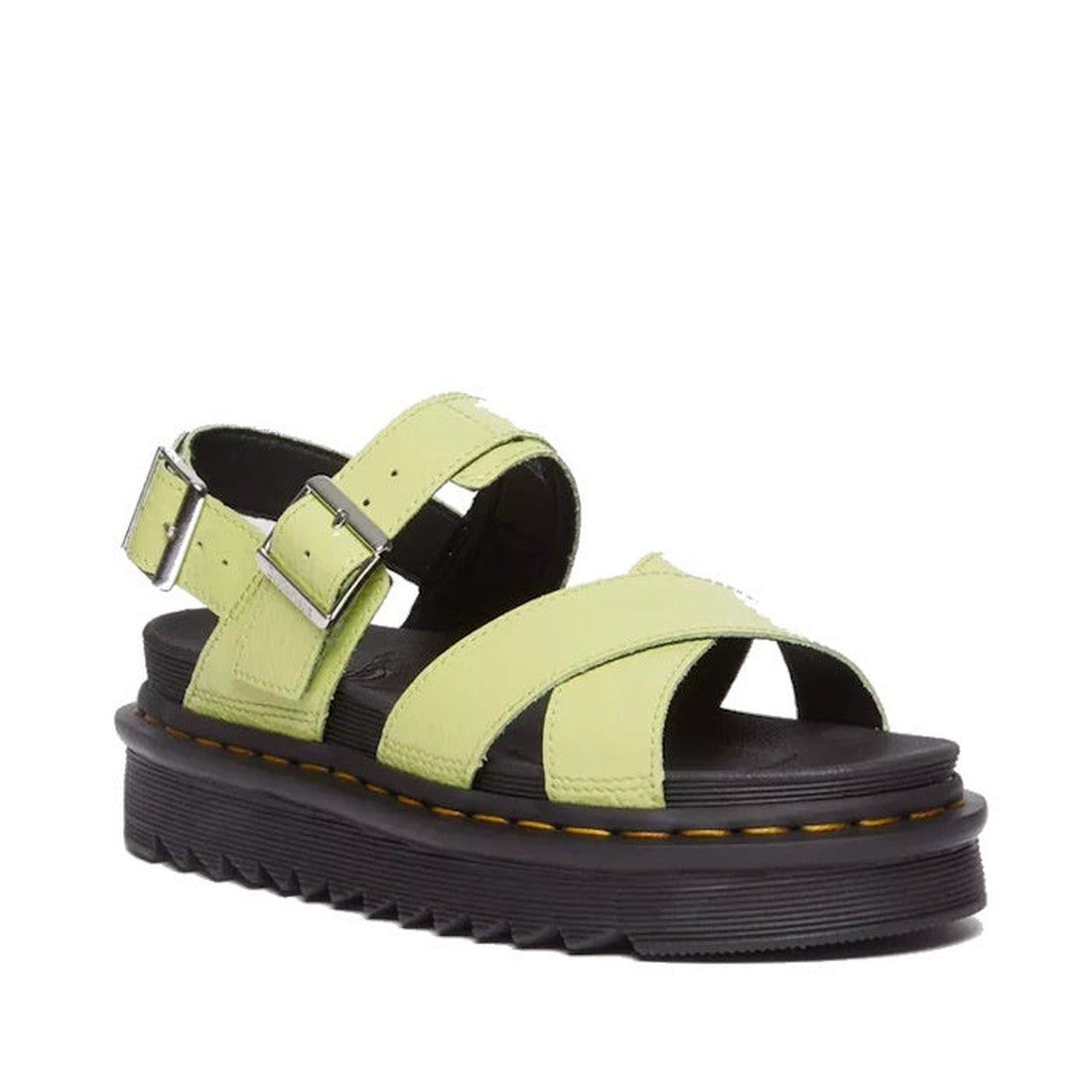 The Dr Martens Voss II Cross Strap Sandal features distressed patent lime green leather straps, adjustable silver buckles, and a thick black sole with signature yellow stitching.