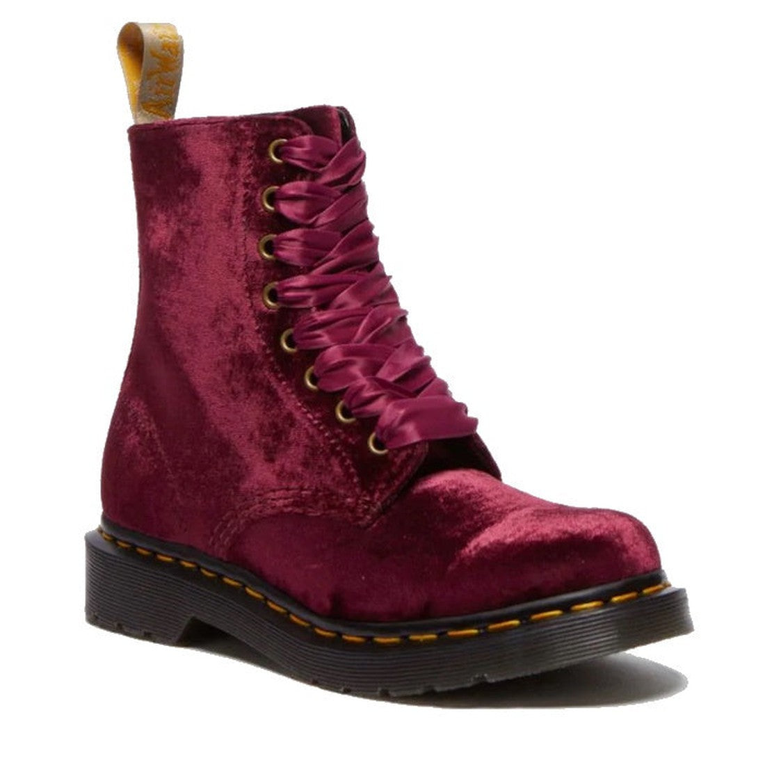 The Dr Martens 1460 Vegan Pascal Cherry Red Velvet 8 Eye Boot features maroon vegan velvet, wide satin ribbon laces, yellow stitching on a black sole, and a yellow heel pull tab for a bold, grunge-inspired look.