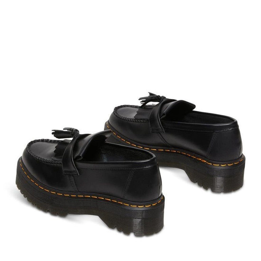 The Dr Martens Adrian Quad Black Smooth Loafer Shoes feature chunky, ridged soles and yellow stitching on Goodyear-welted edges, inspired by the classic Adrian design and shown against a white background., 30429, 30437, 190665522402, 190665522419, 1906655
